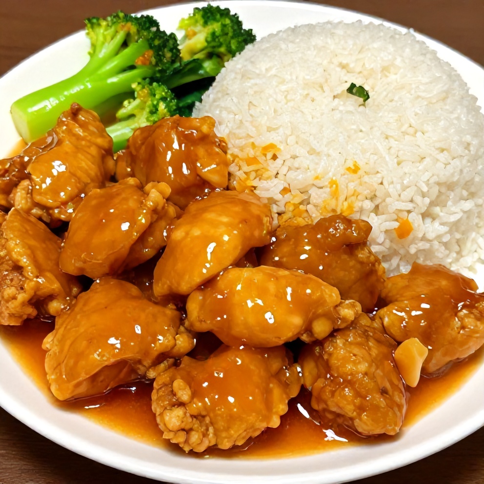 Plated orange chicken with steamed rice