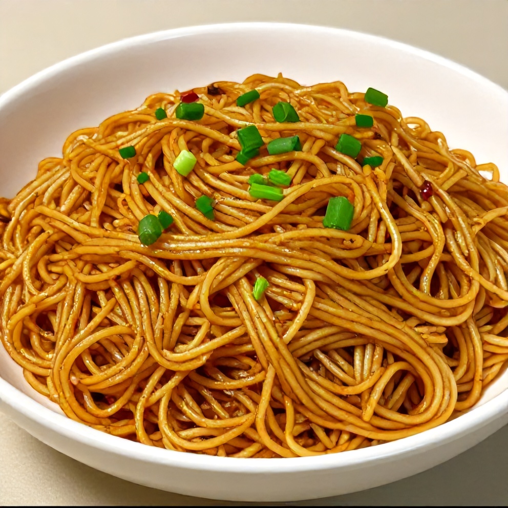 Perfect plated serving of spicy potato noodles garnished with chopped green onions on a white bowl